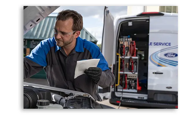 technician checking on engine