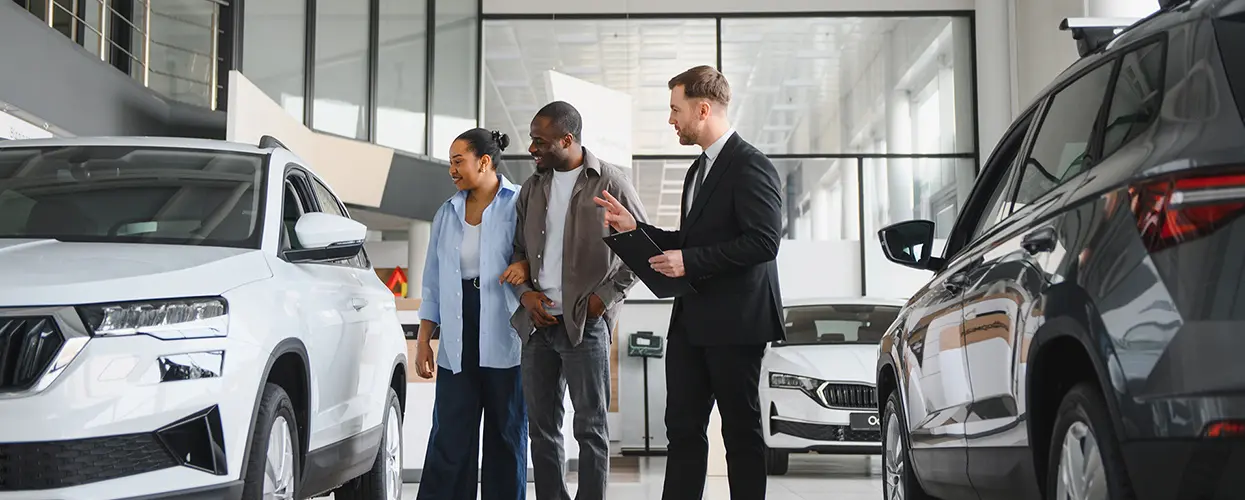 people car shopping in showroom