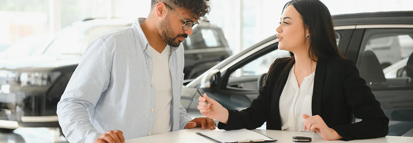 people shopping for a new car at our dealership showroom