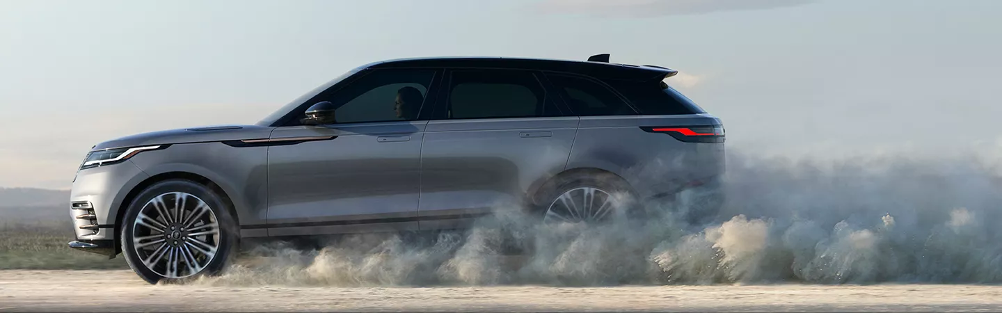 2026 Range Rover Velar driving on a dusty road