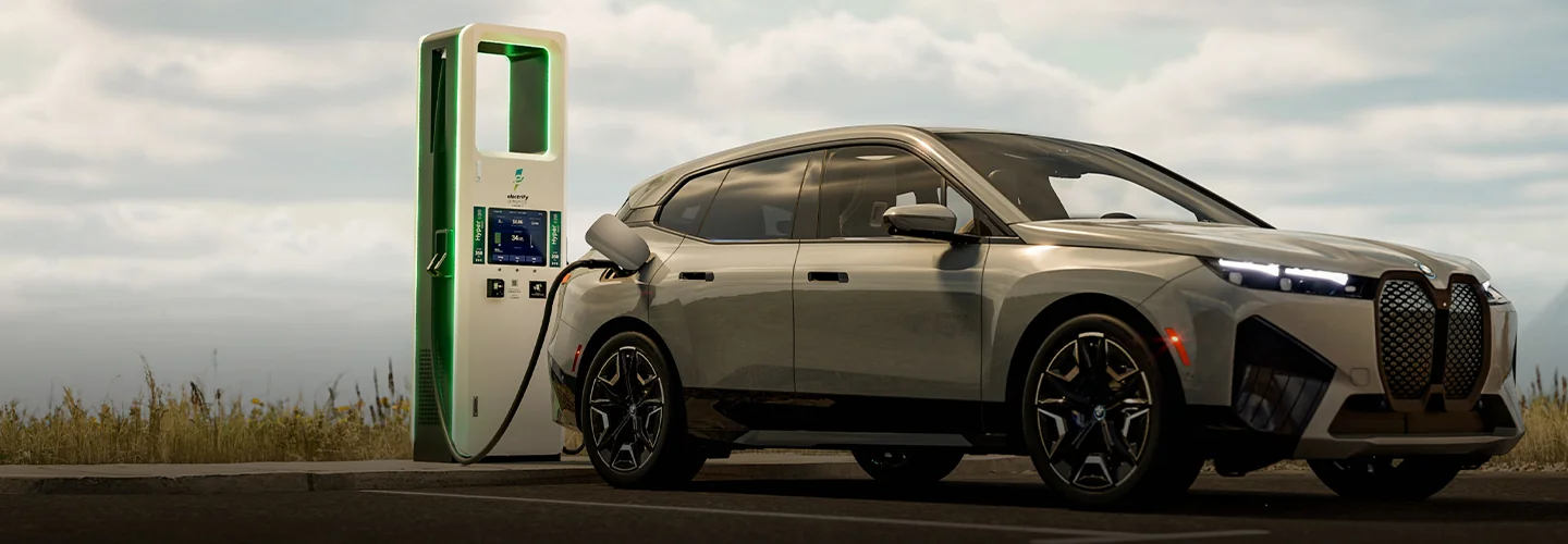 Electric BMW vehicle charging at a charging station