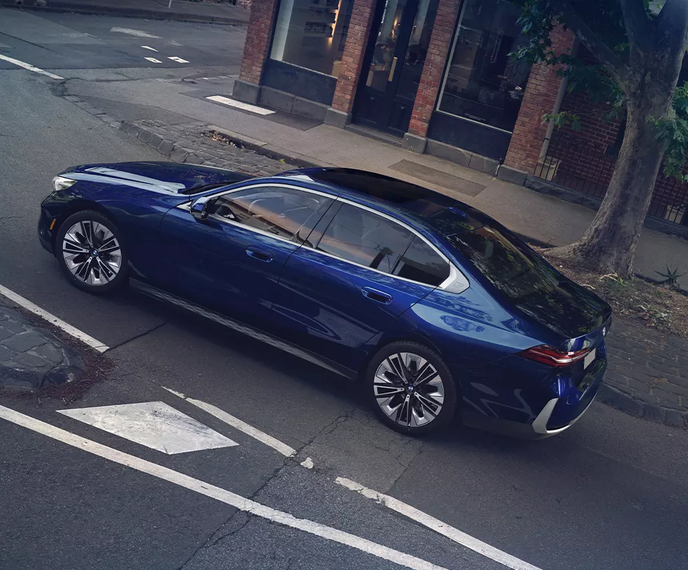 rear shot of blue the new BMW 530i sedan