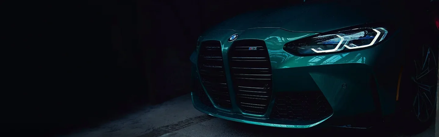 View of the grill of a green 2024 BMW M3