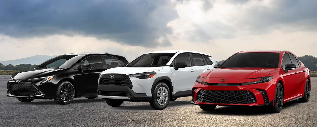 an all Toyota lineup of cars, black. red and white