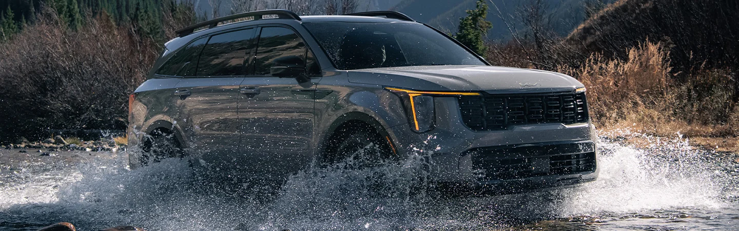 2024 Kia Sorento driving through creek