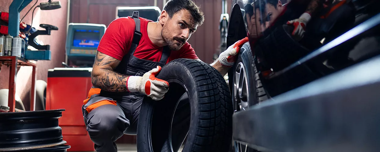 Service mechanic changing a vehicles tires