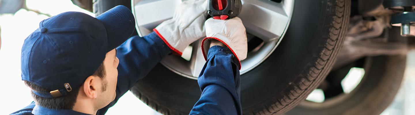 Service technician working on tire