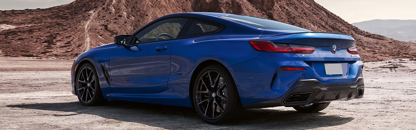 2024 BMW 8 Series Coupe blue color rear sideview