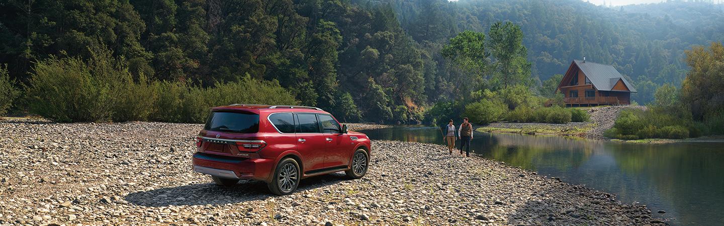 Red 2021 Nissan Armada parked at a lake