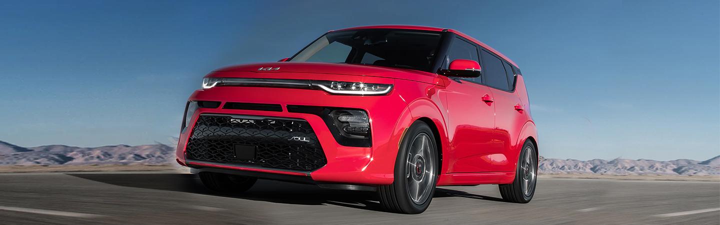 red kia sould driving