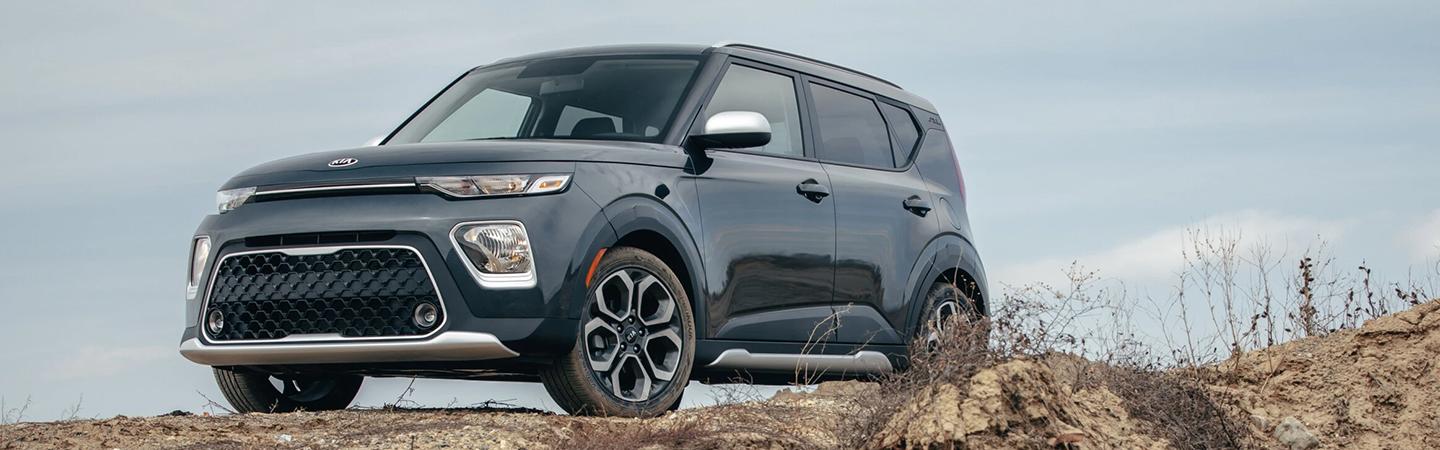 gray kia soul parked on hill