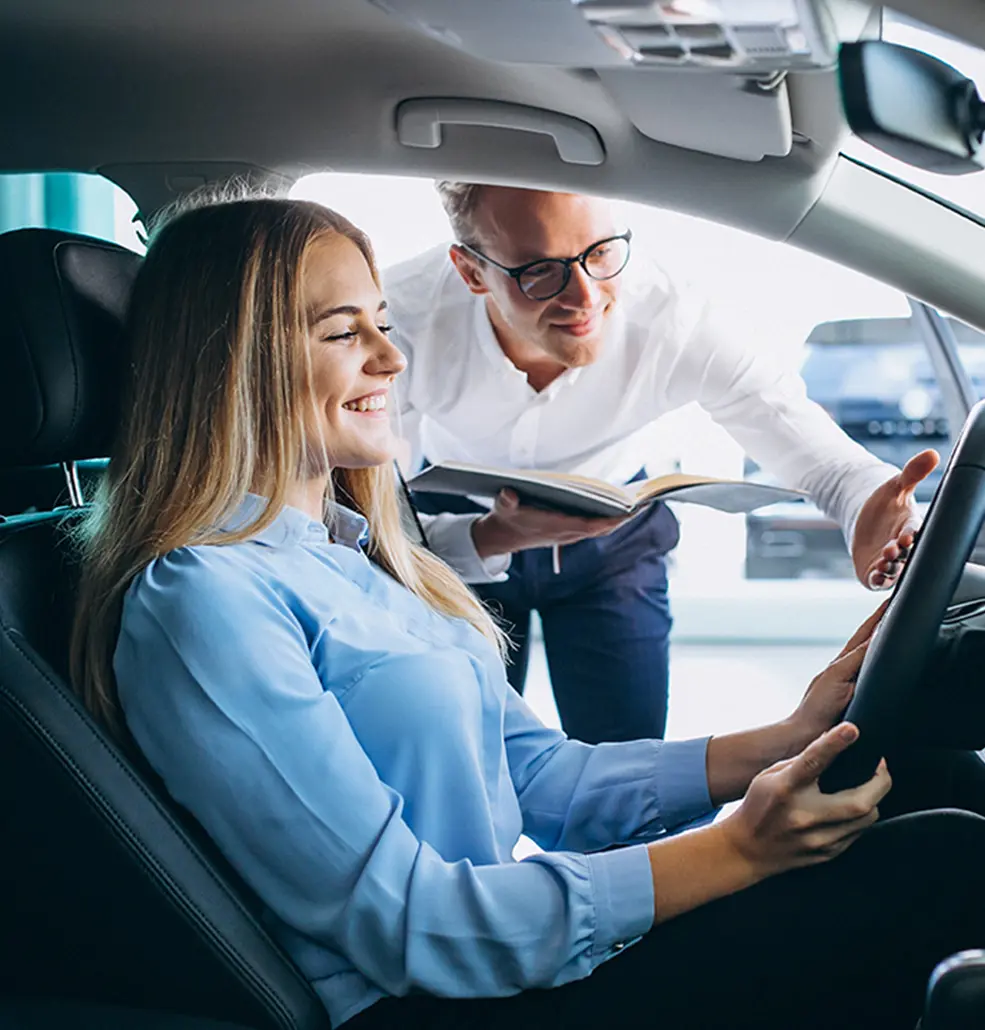 representative showing a new car to customer