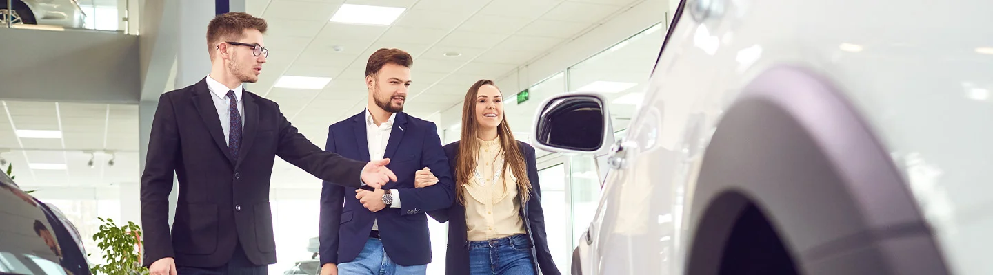 people looking at new cars