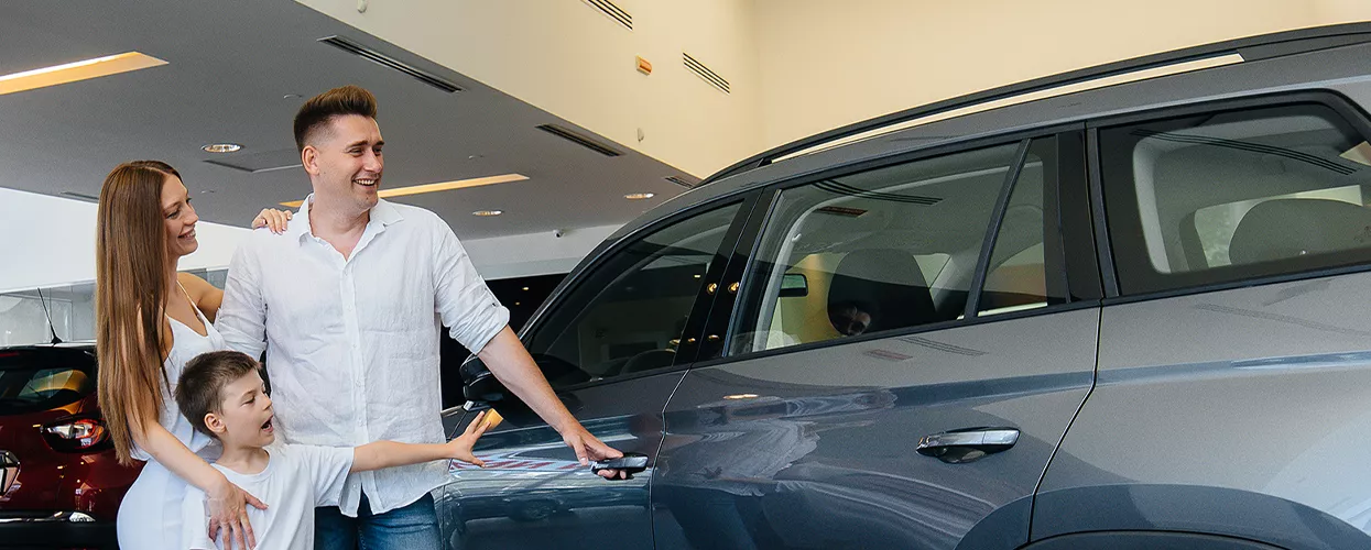 goofy family looking at new car
