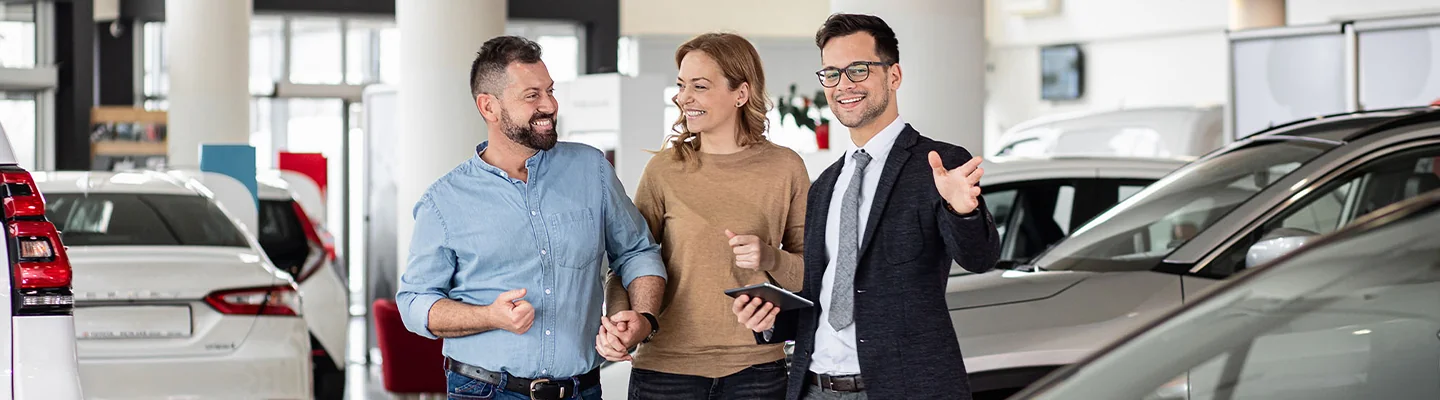 BMW sales person talking to customers about there lease and finance options