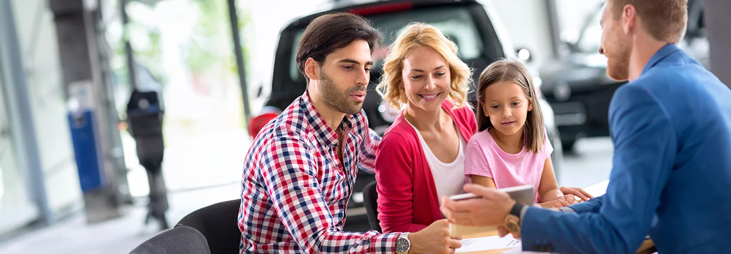 Family sitting at the INFINITI dealership