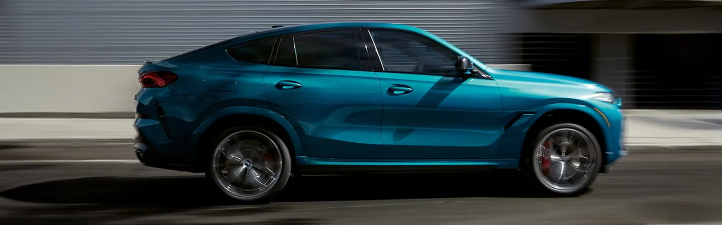 2025 BMW X6 Specs blue color and side view 