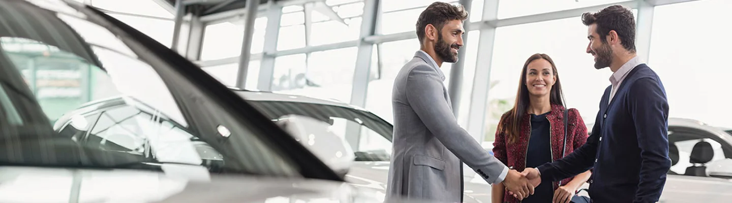 making car deal in showroom