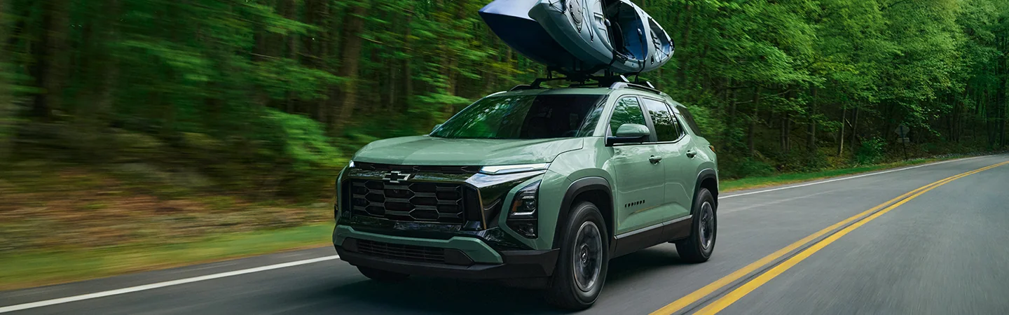 2026 Chevrolet Equinox driving on a country road