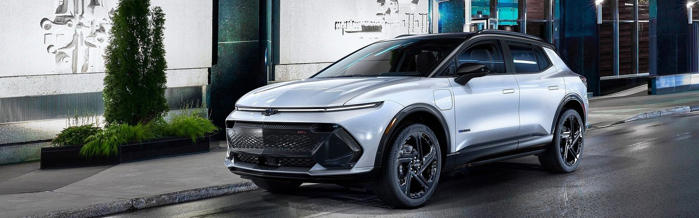 GMC Terrain vs Chevrolet Equinox side front in white colour