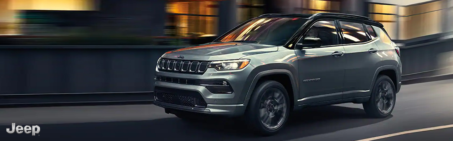 2023 Jeep Compass vs. HR-V Side front in gray colour 