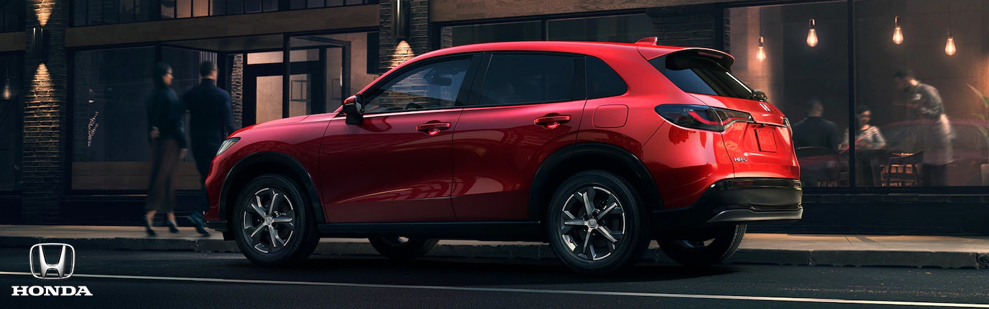 2023 Jeep Compass vs. HR-V Side front in red colour