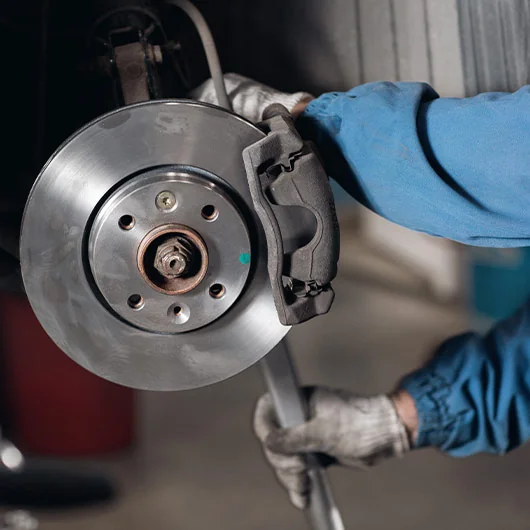 Ford Brake Service | Ford mechanic working on brakes