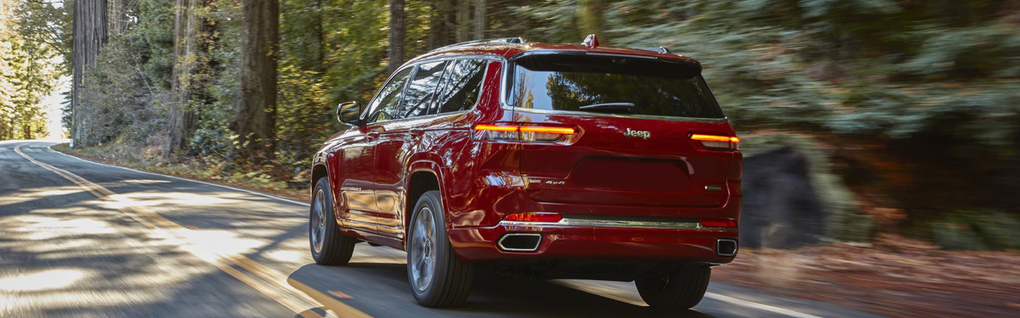 2023 Jeep Grand Cherokee Vs Ford Explorer red backview