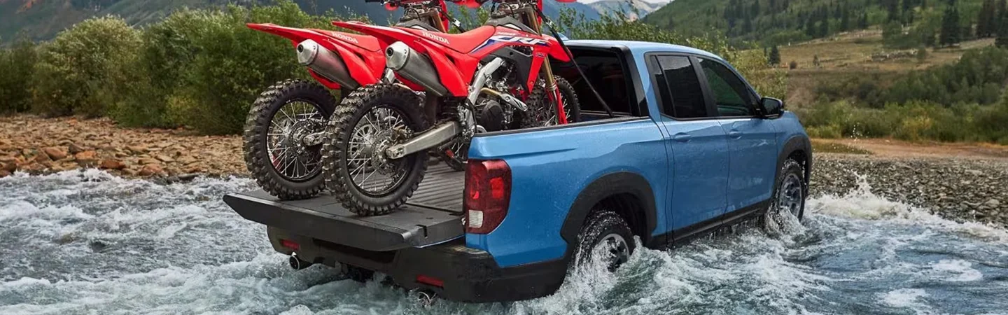 2024 Honda Ridgeline vs Ford Ranger bluecolor backview