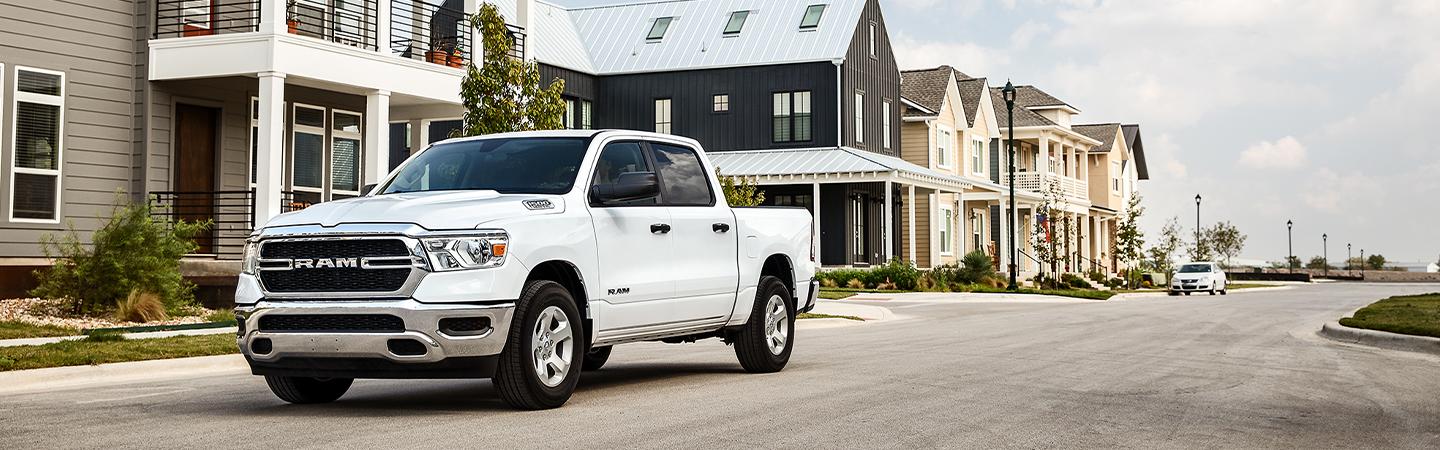 White 2021 RAM 1500 in motion side view