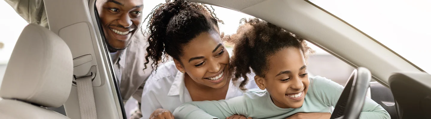 family car shopping in showroom