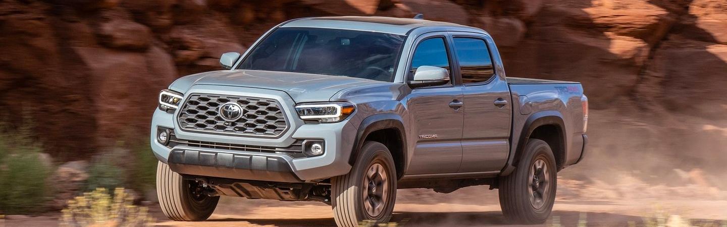 Silver 2020 Toyota Tacoma Driving By Red Rocks