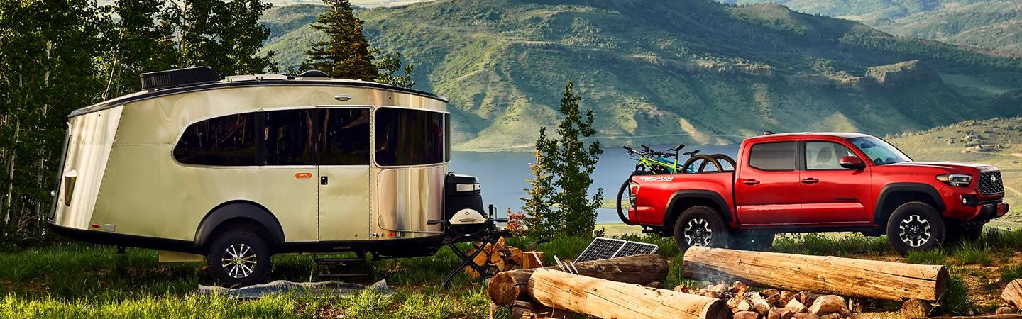 2022 Toyota Tacoma with camper nearby