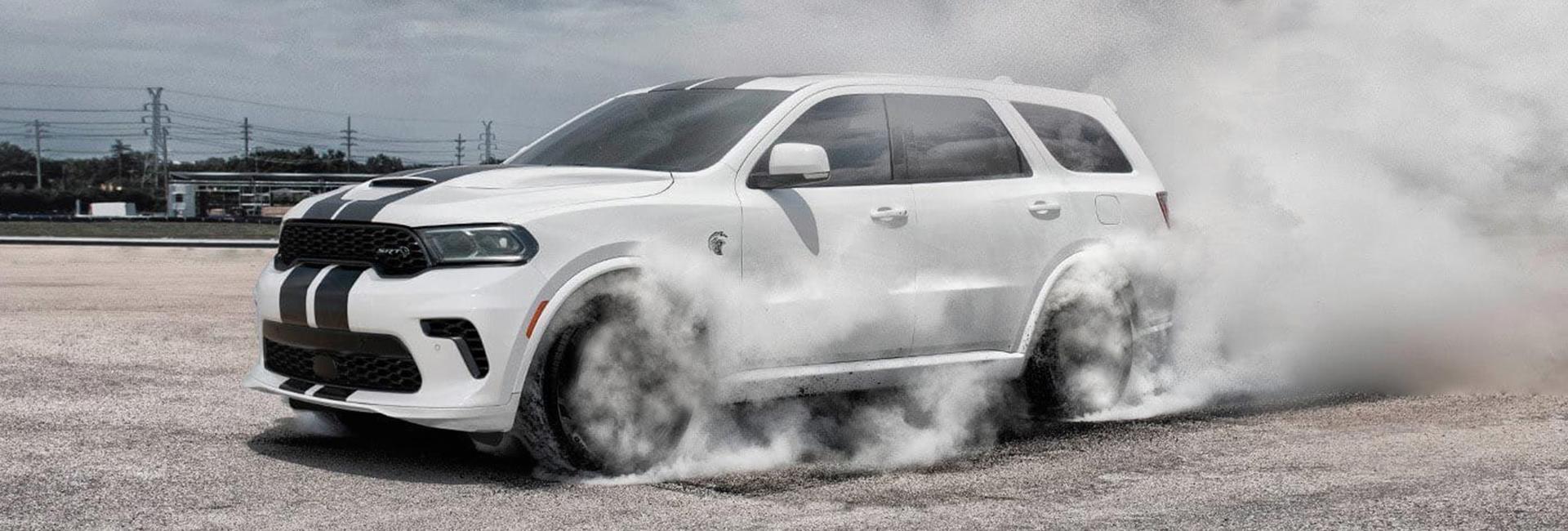 White 2021 Dodge Durango smoking tires
