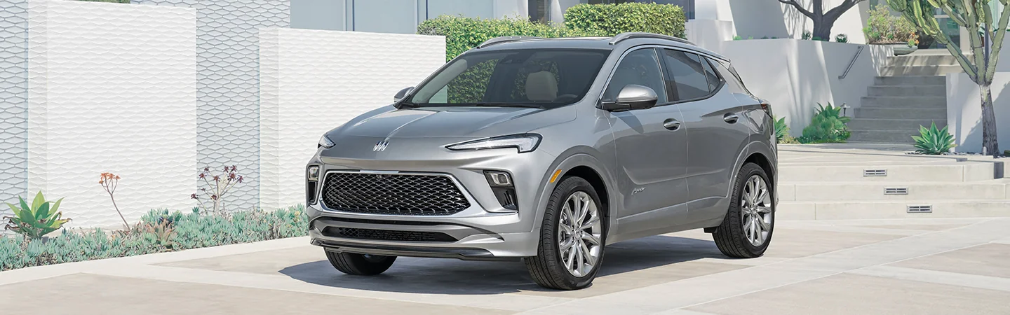 Front side view of a parked 2025 Buick Encore GX in a driveway