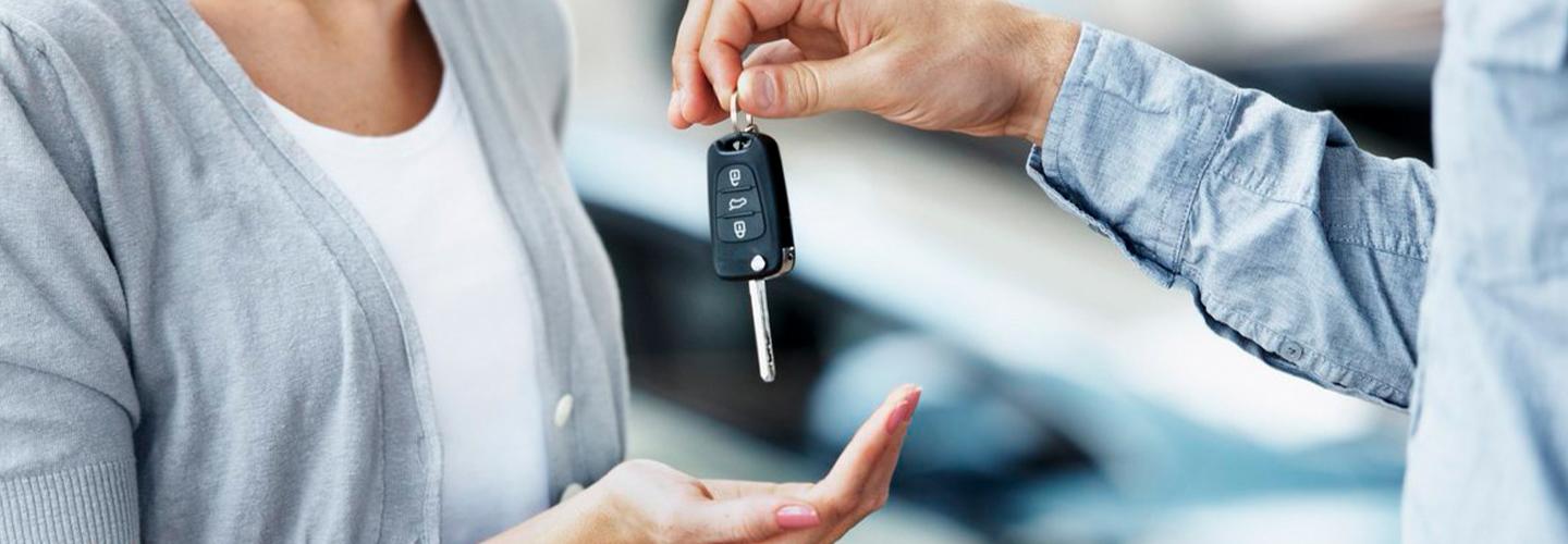 person handing another keys