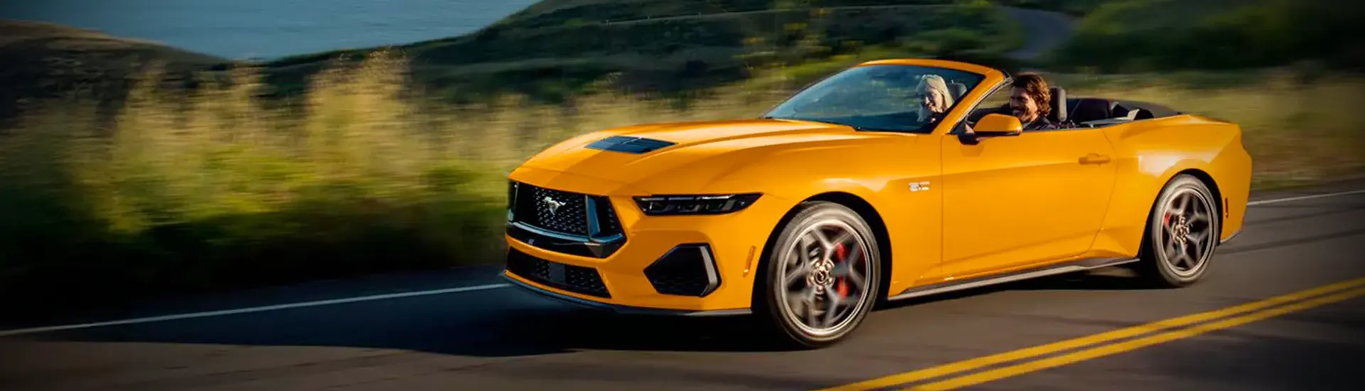 yellow 2026 Ford Mustang EcoBoost Fastback cruising