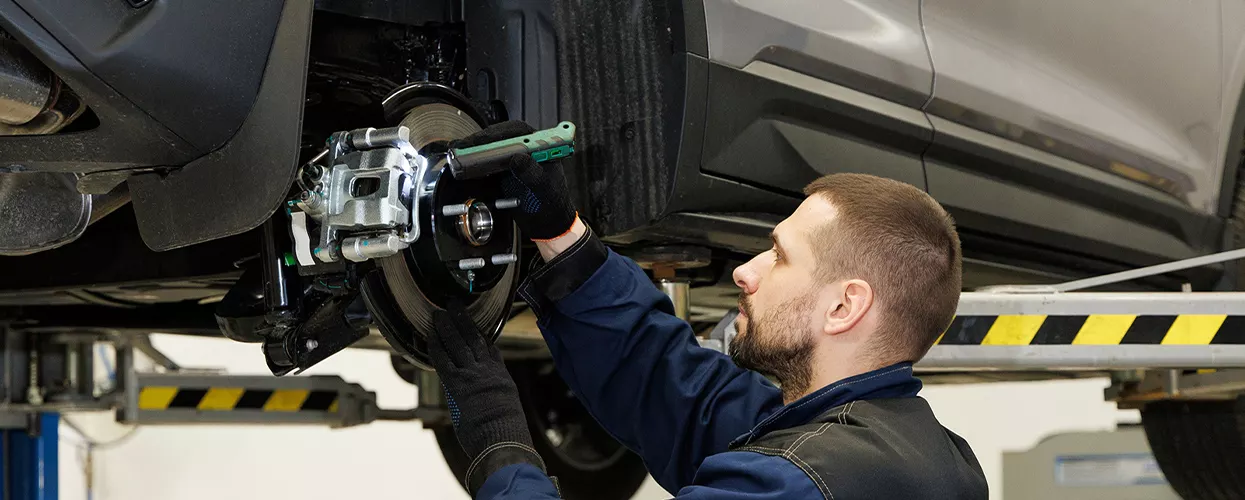 mechanic performing brake service