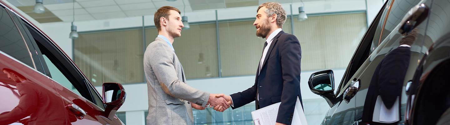 Salesperson and customer shaking hands