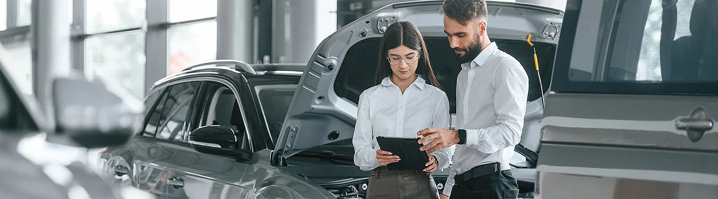 techs working on car engine