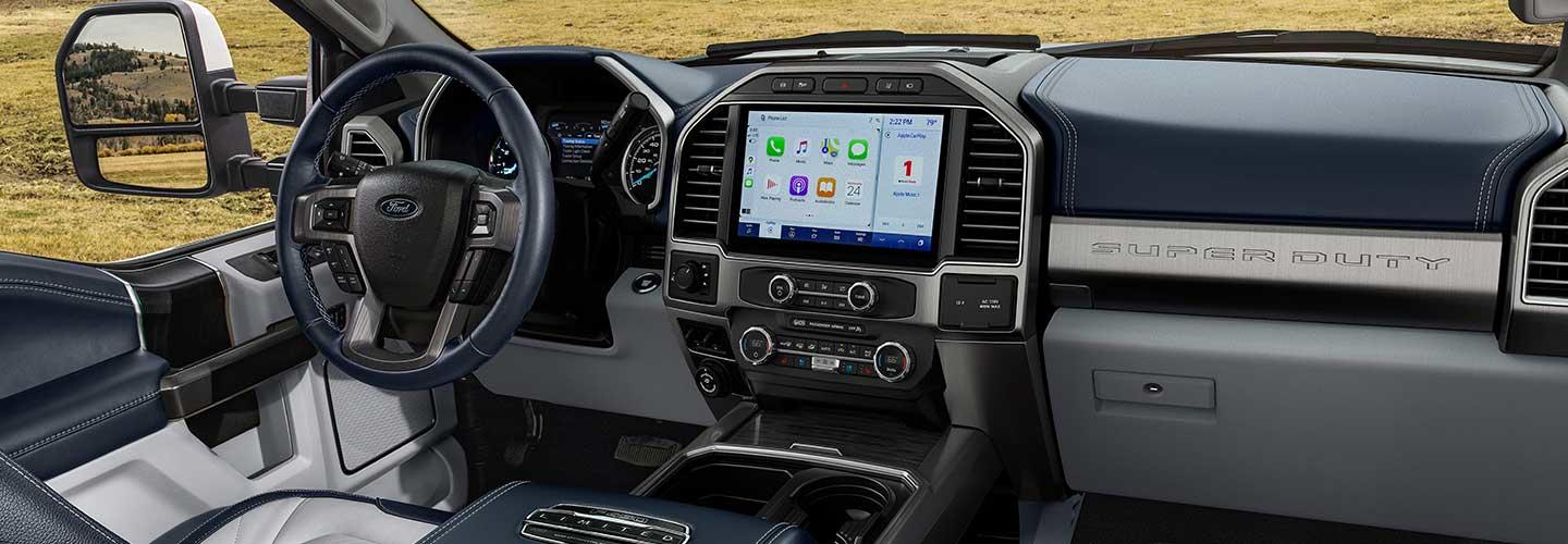 Close up view of a 2022 Ford Super Duty truck’s steering wheel and dashboard