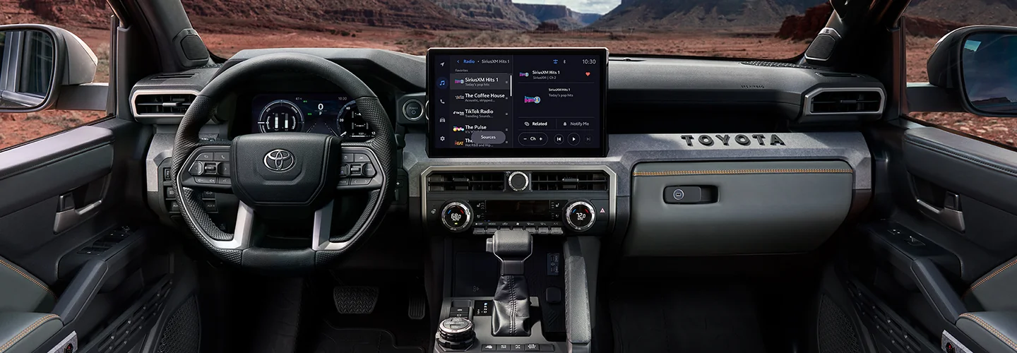 Interior view of the dashboard and tech in a 2025 Toyota Tacoma