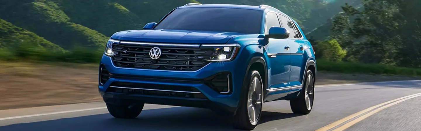 2024 Volkswagen Atlas Cross Sport Specs blue color and front view 