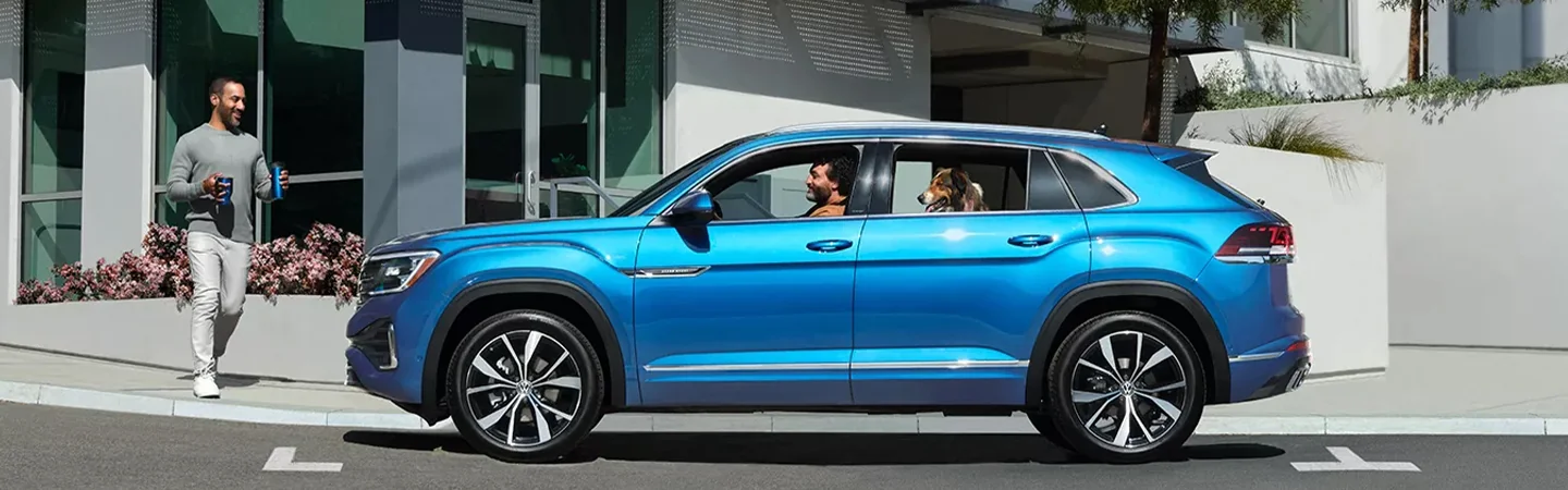 2024 Volkswagen Atlas Cross Sport Specs blue color and side view 