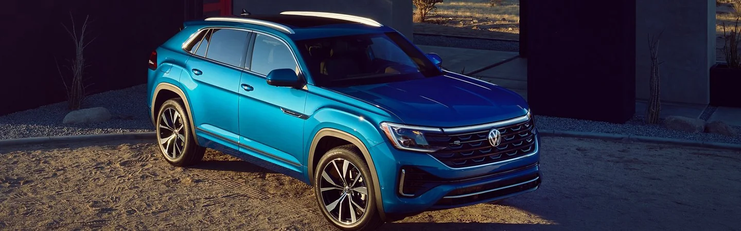 2024 Volkswagen Atlas Cross Sport Specs blue color and front view 