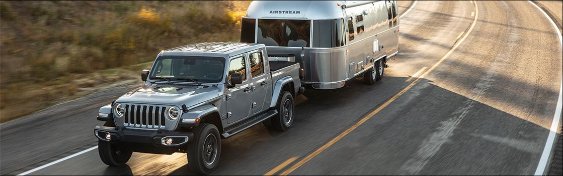 gray Jeep Gladiator pulling an Airstream