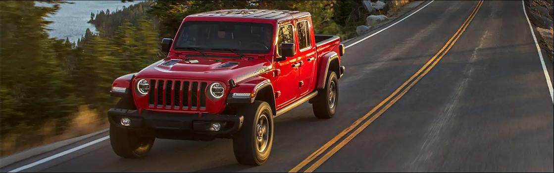 red Jeep Gladiator driving