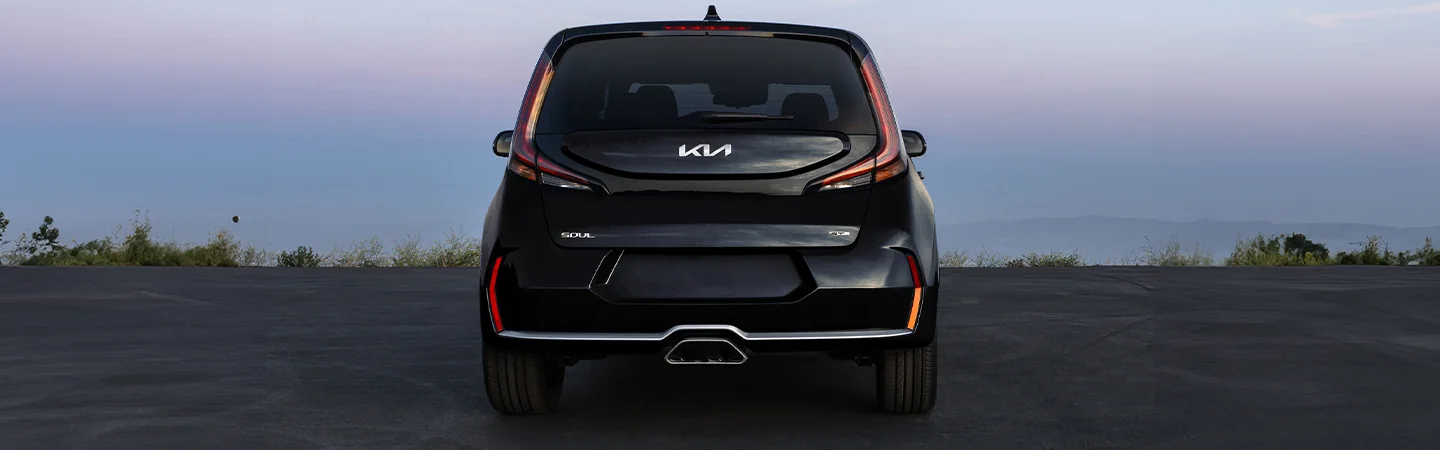 Back view of a parked black 2025 Kia Soul overlooking the ocean