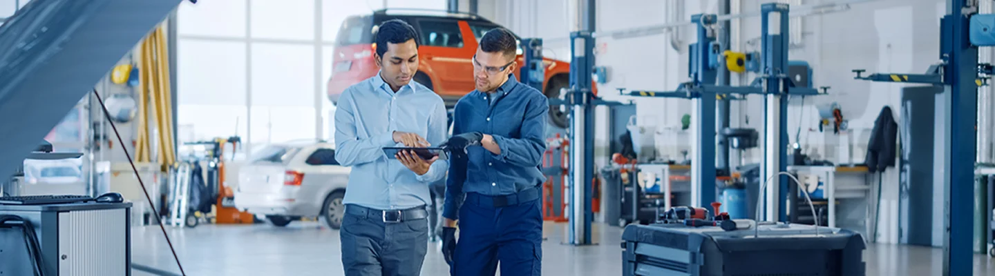 men discussing service of cars