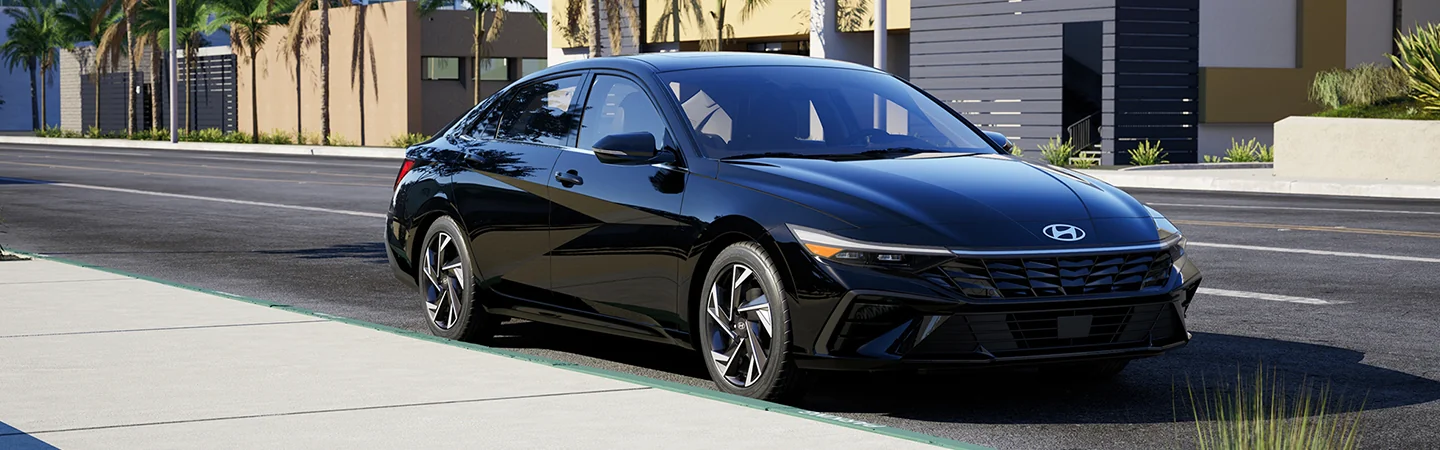 black 2025 Hyundai Elantra N-Line parked by houses